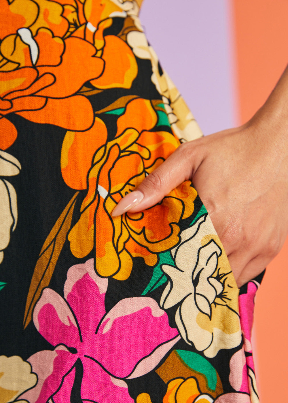 Hand in pocket detail of retro floral summer midi dress