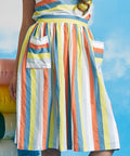 Close-up detail of oversized patch pocket on multicolor pastel stripe dirndl skirt