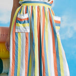 Close-up detail of oversized patch pocket on multicolor pastel stripe dirndl skirt
