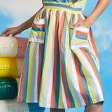 Close-up of vintage-style striped skirt with oversized pockets and gathered waist detail