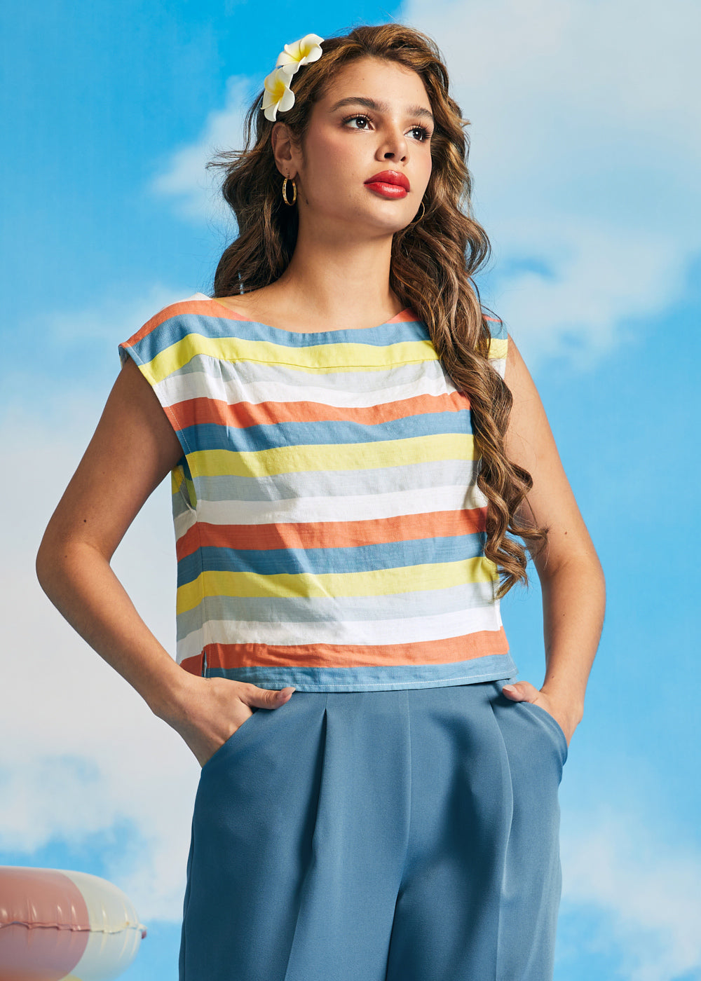 Woman wearing retro-inspired striped crop top with relaxed fit and cap sleeves