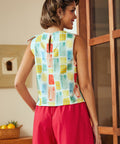 Back view of sleeveless blouse with keyhole button closure
