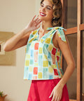 Model wearing relaxed fit sleeveless blouse with cropped length