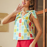 Model wearing relaxed fit sleeveless blouse with cropped length