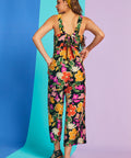 Rear view of retro floral jumpsuit with bow-back detail and cropped wide legs
