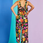 Rear view of retro floral jumpsuit with bow-back detail and cropped wide legs