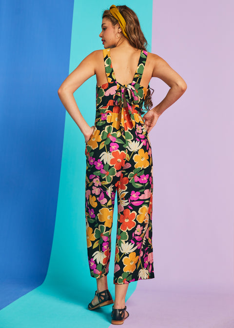 Rear view of retro floral jumpsuit with bow-back detail and cropped wide legs