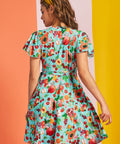 Back view of aqua fruit print wrap mini dress with short flutter sleeves