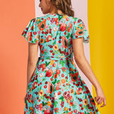 Back view of aqua fruit print wrap mini dress with short flutter sleeves