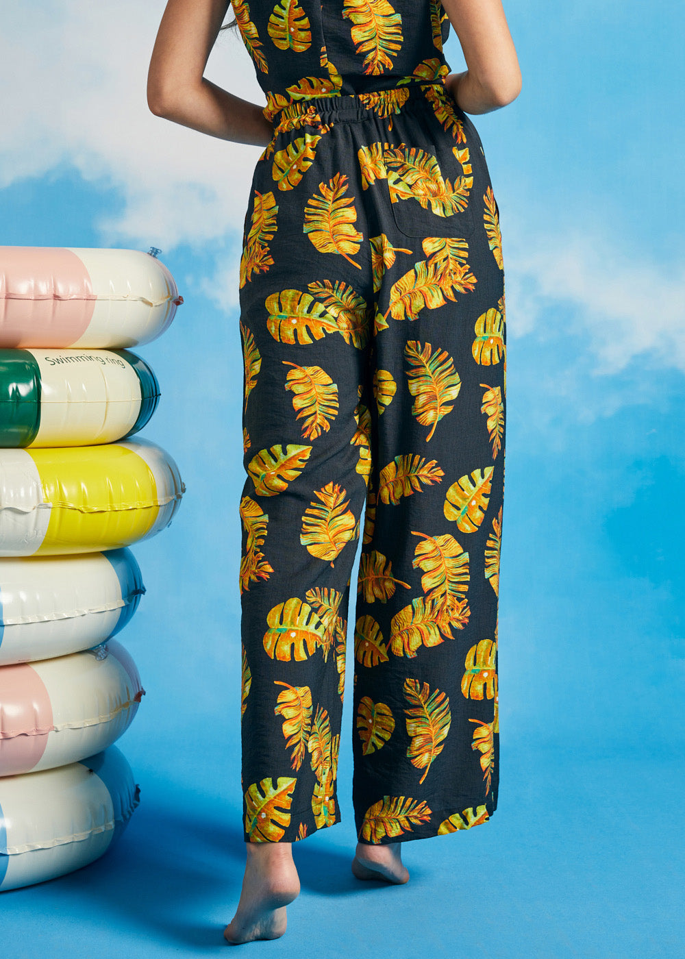 Back view of tropical wide-leg palazzo pants with elasticized waistband