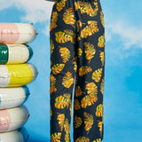 Back view of tropical wide-leg palazzo pants with elasticized waistband
