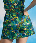 Close-up back view of tropical jungle print shorts with relaxed silhouette