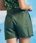 Back view of olive green utility shorts with large rear patch pockets
