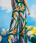 Back view of colorful abstract print palazzo pants with elastic side waist inserts