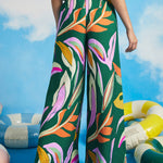 Back view of colorful abstract print palazzo pants with elastic side waist inserts