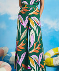 Woman modeling colorful wide-leg palazzo pants with relaxed vacation-ready styling