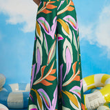 Woman wearing retro-inspired tropical print palazzo pants with wide legs