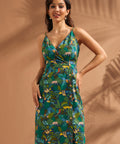 Front view of vintage-inspired jungle print midi dress with faux-wrap neckline.