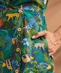 Close-up of the jungle novelty print with decorative buttons and side pocket.