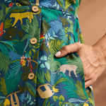 Close-up of the jungle novelty print with decorative buttons and side pocket.