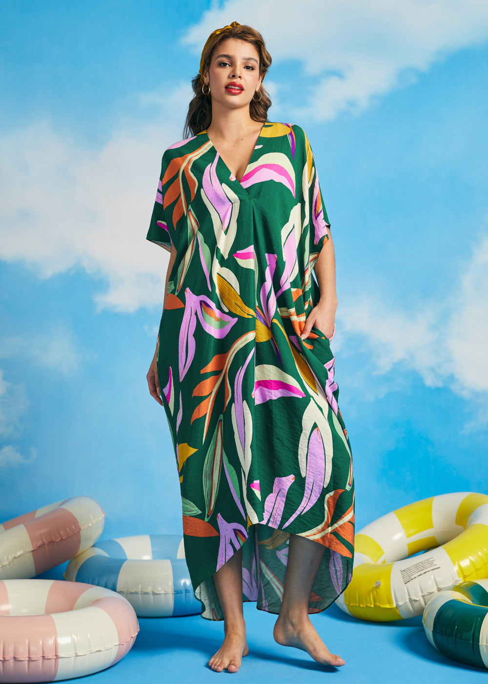 Front view of relaxed fit tropical maxi caftan dress with colorful retro palm print
