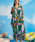 Front view of relaxed fit tropical maxi caftan dress with colorful retro palm print