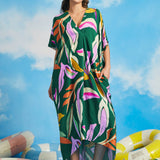Front view of relaxed fit tropical maxi caftan dress with colorful retro palm print