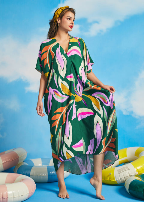 Front view of green oversized resort caftan dress with flowing silhouette and short sleeves