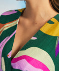 Close-up of V-neckline and textured fabric on retro botanical maxi caftan