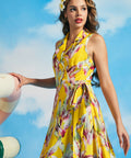 Side view of yellow tropical sleeveless wrap midi dress with tie waist and full skirt