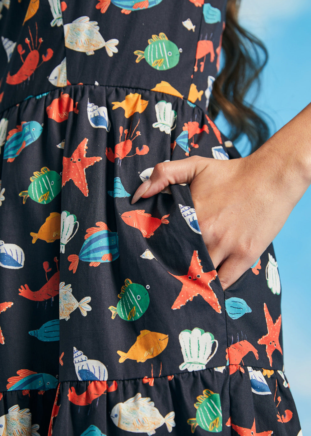 Close-up of side pocket on navy seaside novelty print fit-and-flare dress