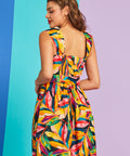 Back view of tropical print fit-and-flare dress with smocked back panel