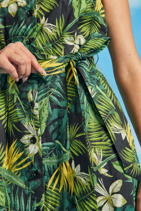 Close-up of waist tie detail on tropical palm print resort dress