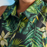 Close-up of tropical botanical print and collared neckline on sleeveless shirt dress