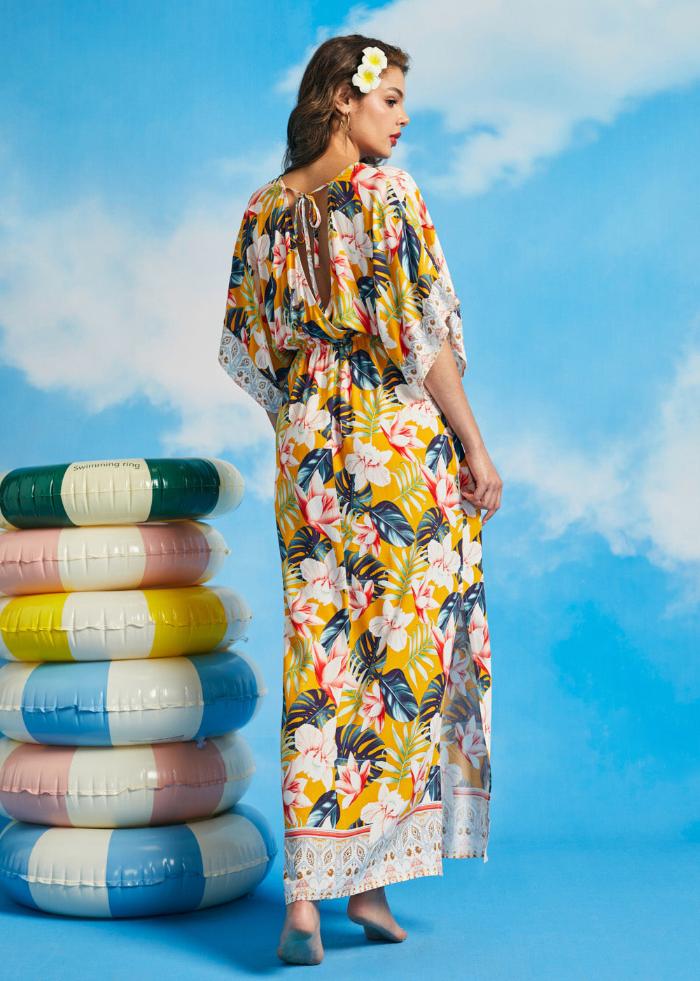 Back view of tropical floral maxi dress with keyhole tie detail