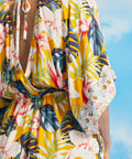 Close-up of tropical floral print and kimono sleeve border detail on maxi dress