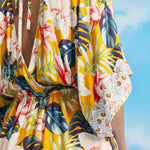 Close-up of tropical floral print and kimono sleeve border detail on maxi dress
