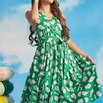 Emerald green vacation dress with ivory shell print and breezy retro-inspired fit