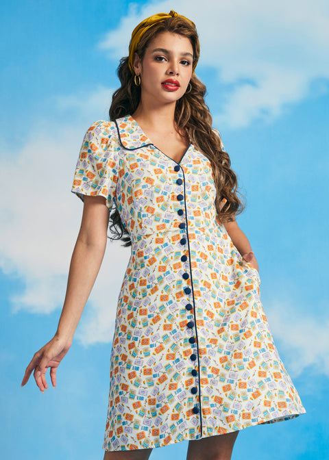 Woman wearing novelty sardine print vintage-inspired shirt dress with short sleeves and contrast piping