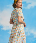 Back view of novelty sardine print mini dress with removable waist tie