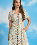 Front view of novelty fish print shirt dress with contrast piping and retro silhouette