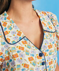Close-up of collar and button-front detail on novelty sardine print shirt dress