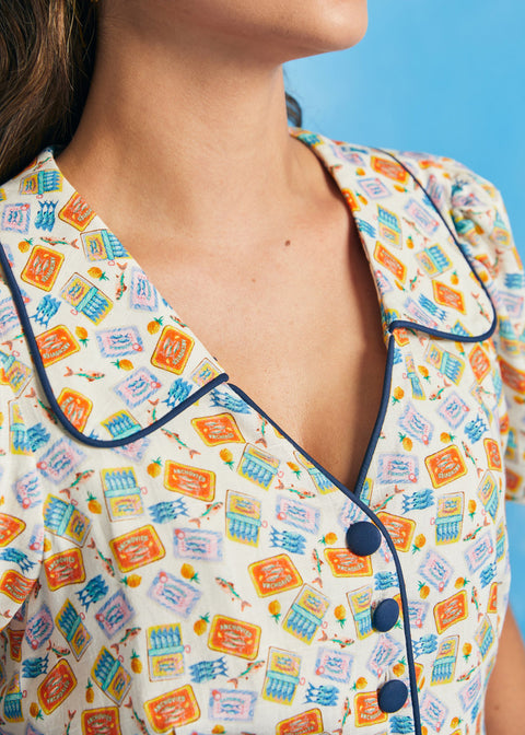 Close-up of collar and button-front detail on novelty sardine print shirt dress