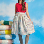 Full-length view of retro-inspired seaside print midi skirt with functional pockets and full silhouette