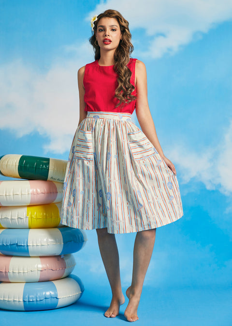 Full-length view of retro-inspired seaside print midi skirt with functional pockets and full silhouette