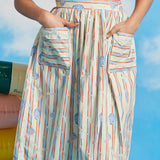 Woman wearing full midi dirndl skirt with starfish stripe print and oversized patch pockets