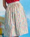 Back view of vintage-inspired gathered cotton skirt with elasticized waistband and novelty coastal print