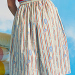 Back view of vintage-inspired gathered cotton skirt with elasticized waistband and novelty coastal print