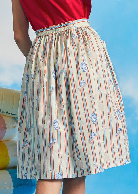 Back view of vintage-inspired gathered cotton skirt with elasticized waistband and novelty coastal print