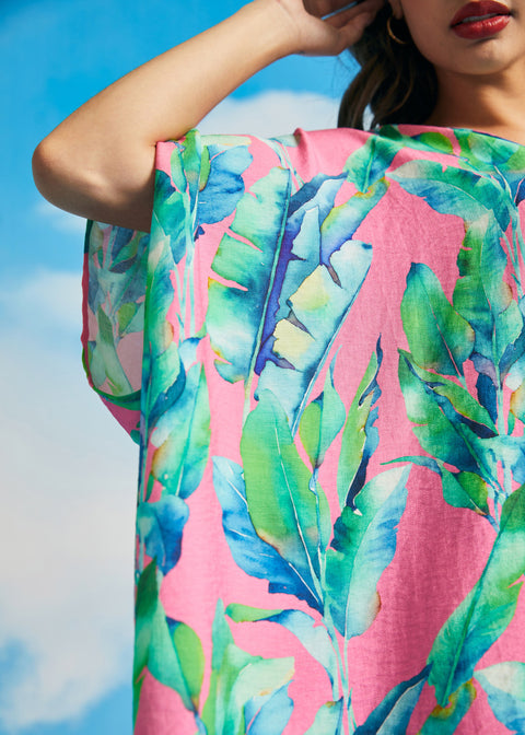 Detail of wide draped sleeve and lightweight woven fabric on tropical caftan